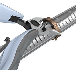 Pliers squeezing the ring to size